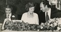 Photograph of Shah Karim al-Hussayni, The Aga Khan IV sitting with Tourism Minister Grace McCarthy at a banquet in his honour, h